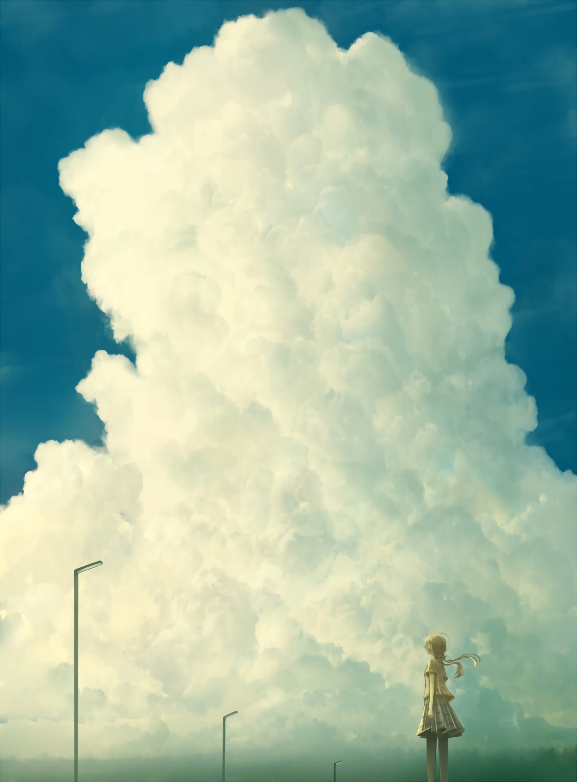 Girl under giant cloud vast blue sky