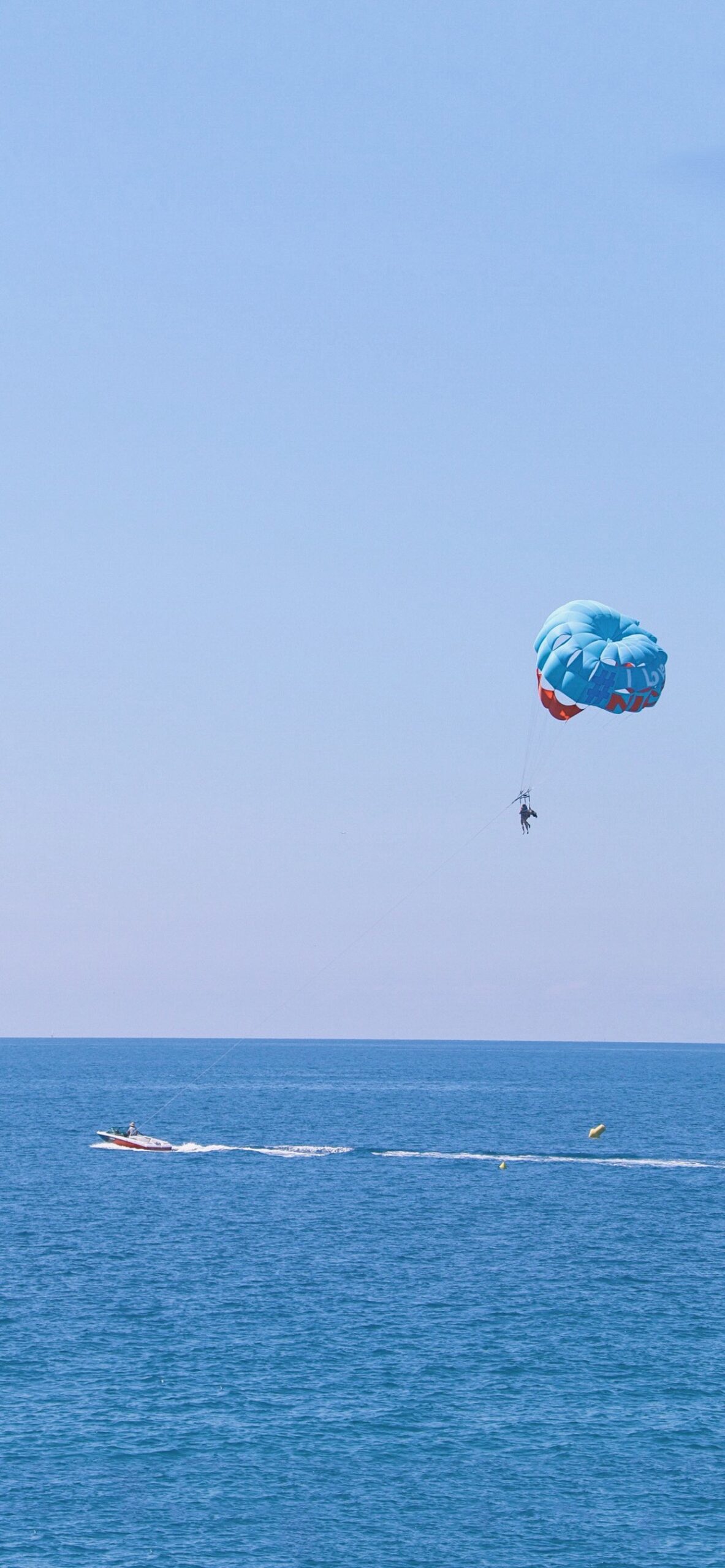 parasailing over sea blue ocean speed
