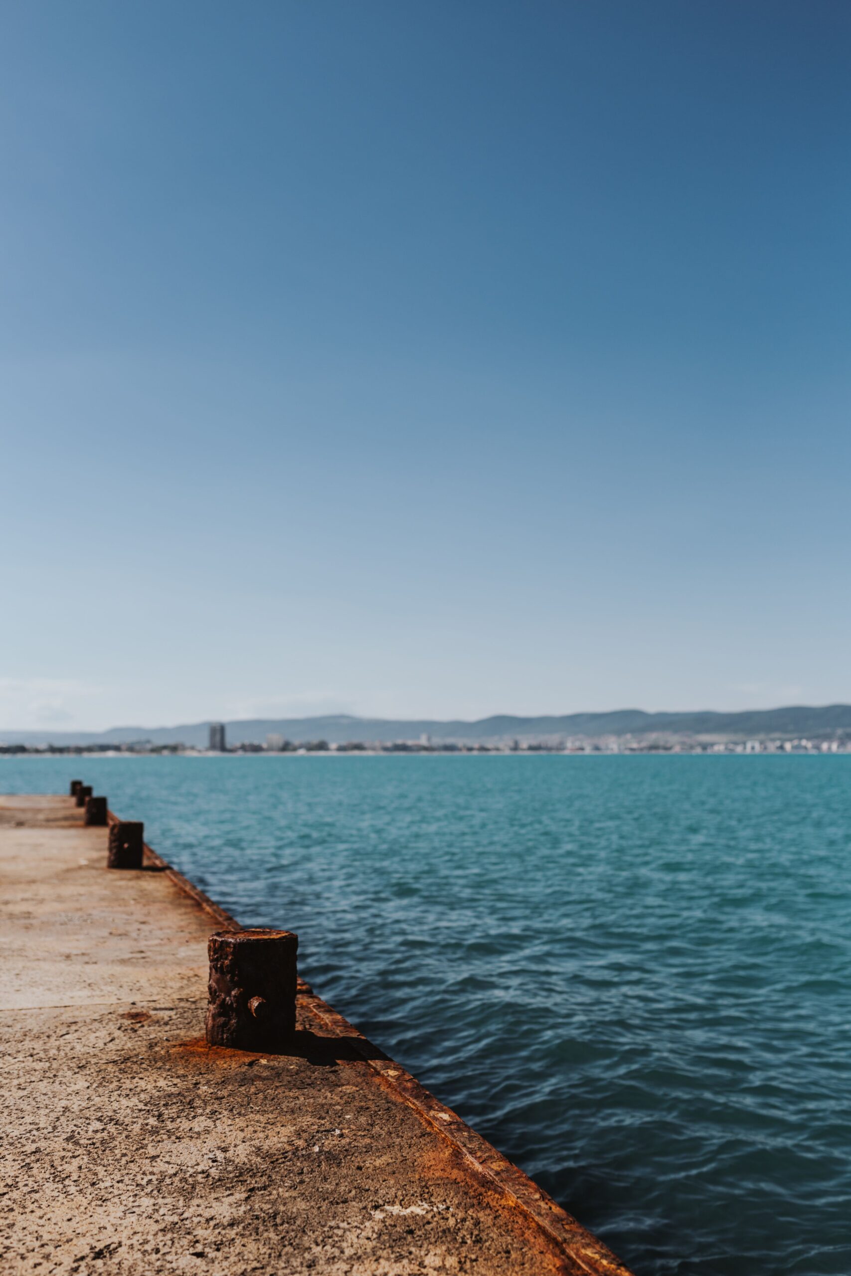rusty pier concrete dock turquoise sea