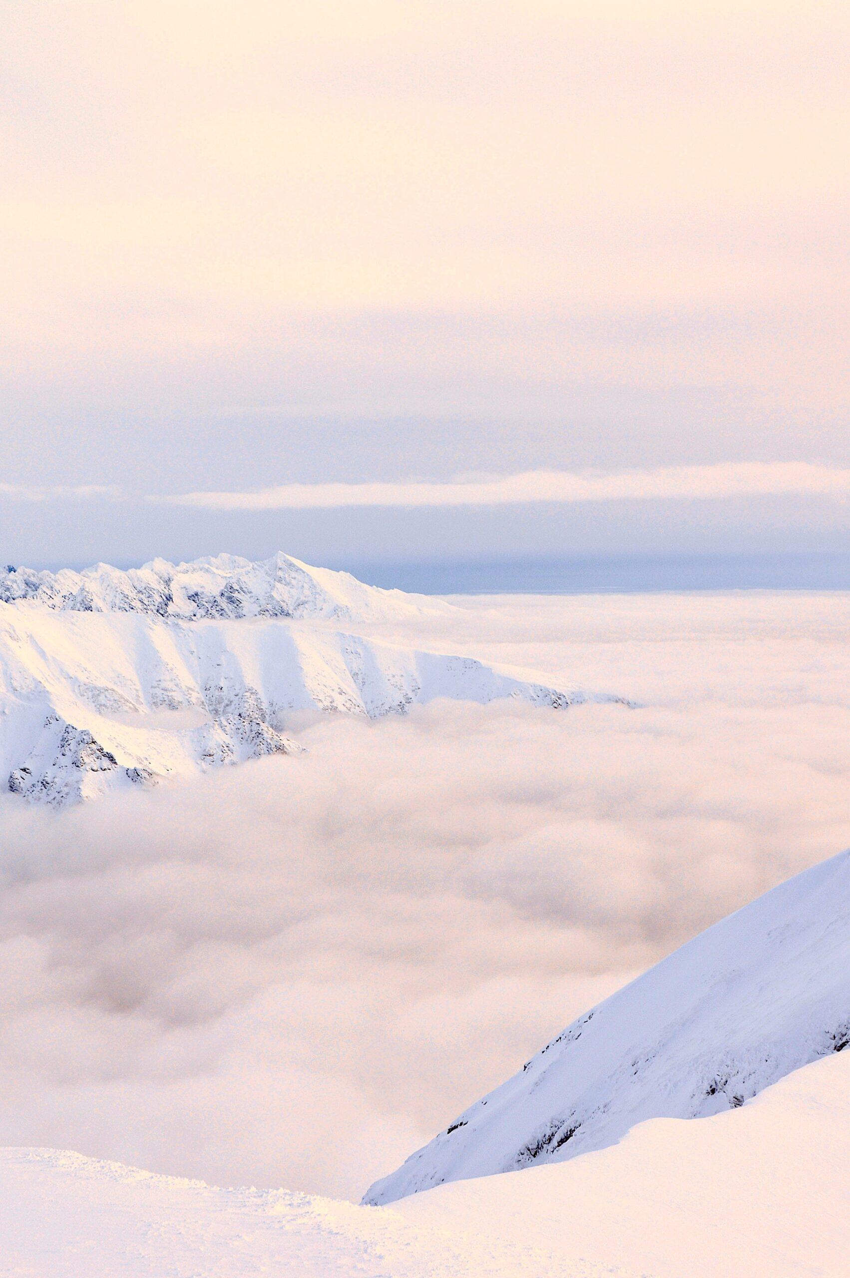 snowy mountains thick fog winter clouds