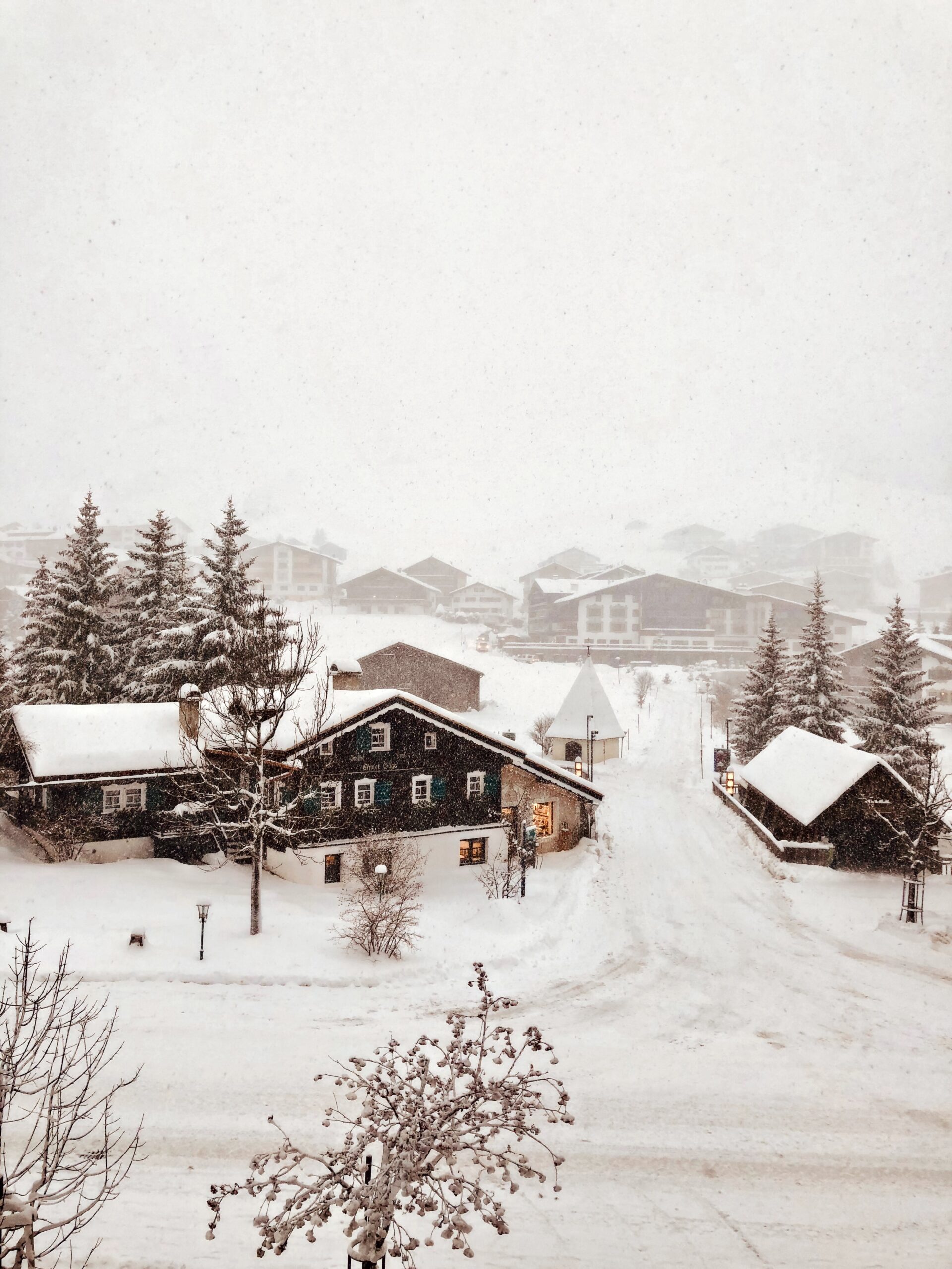 snowy village alpine town falling snow