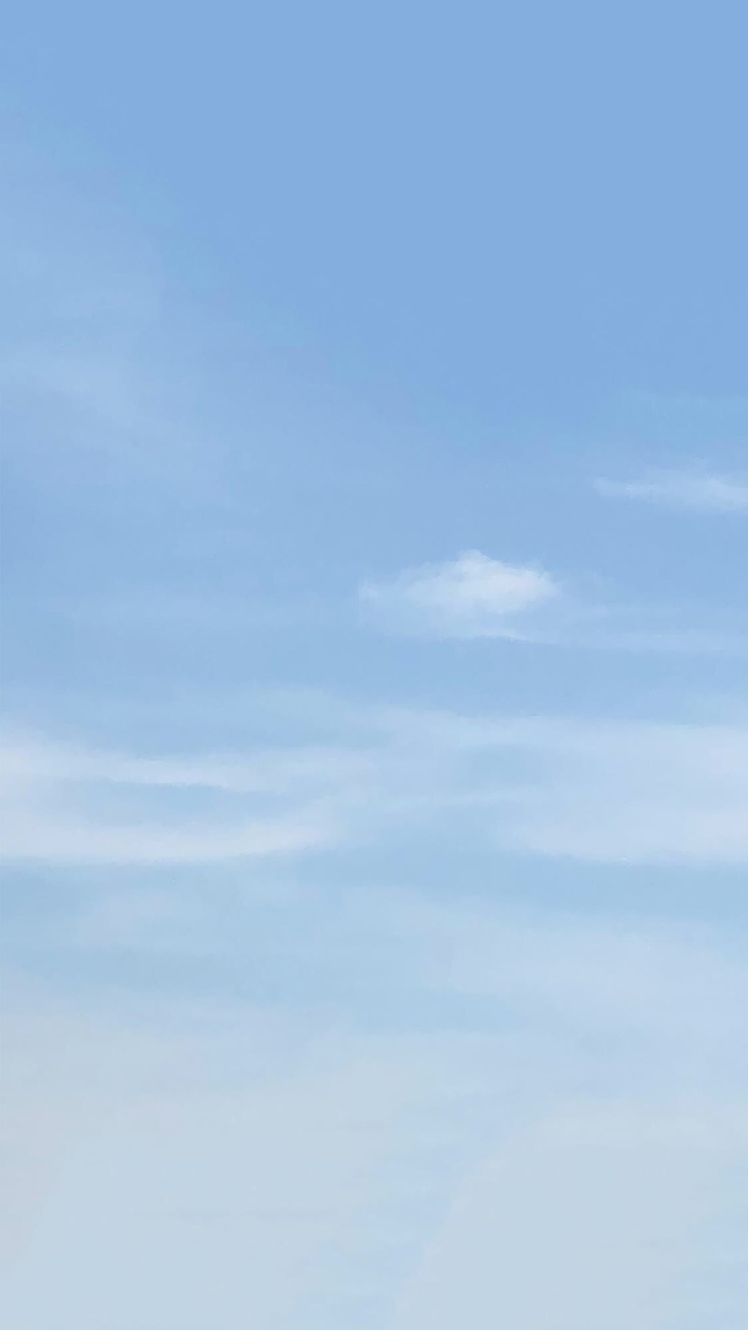 blue sky wispy clouds cirrus haze light