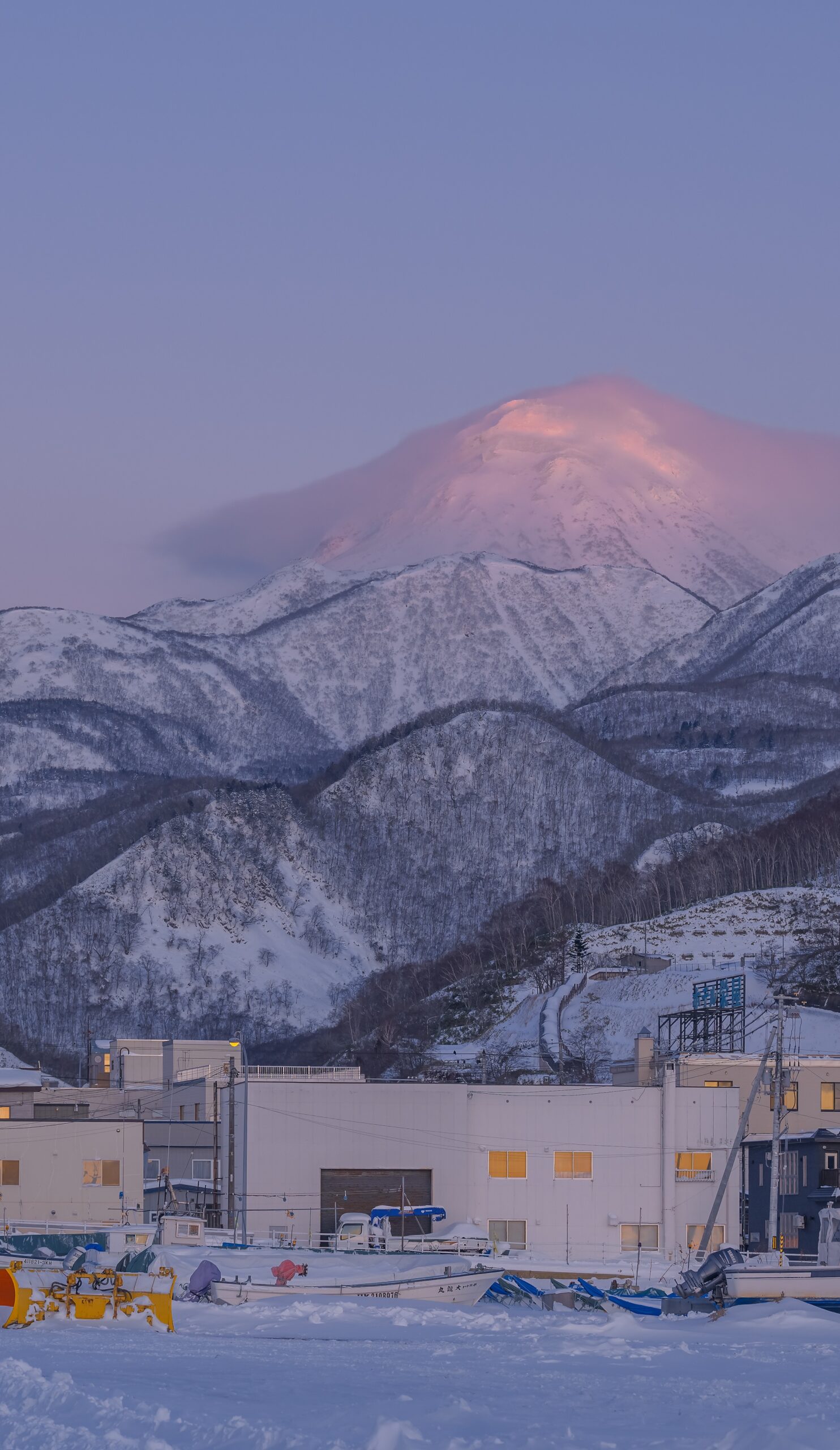 snowy mountain range winter sunrise