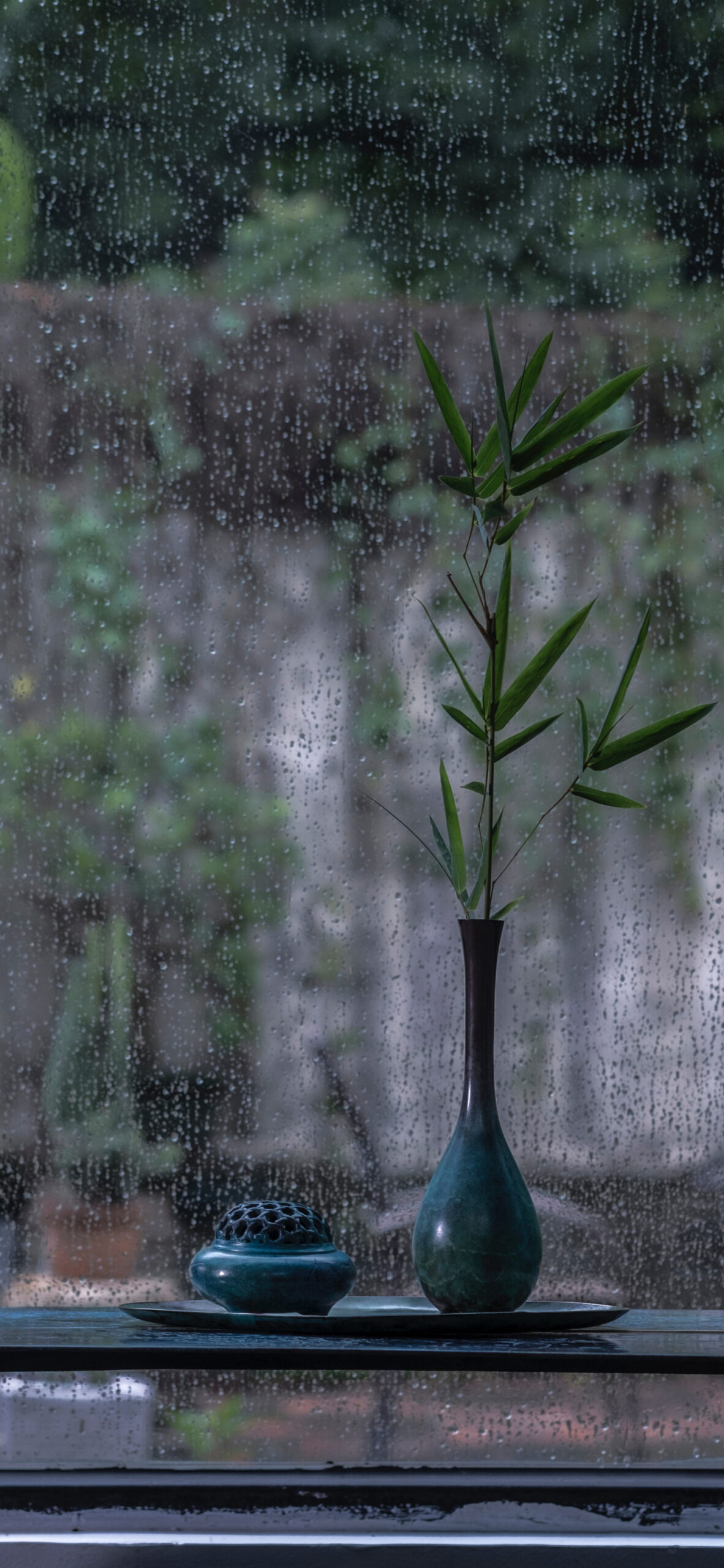 zen bamboo vase interior rain window