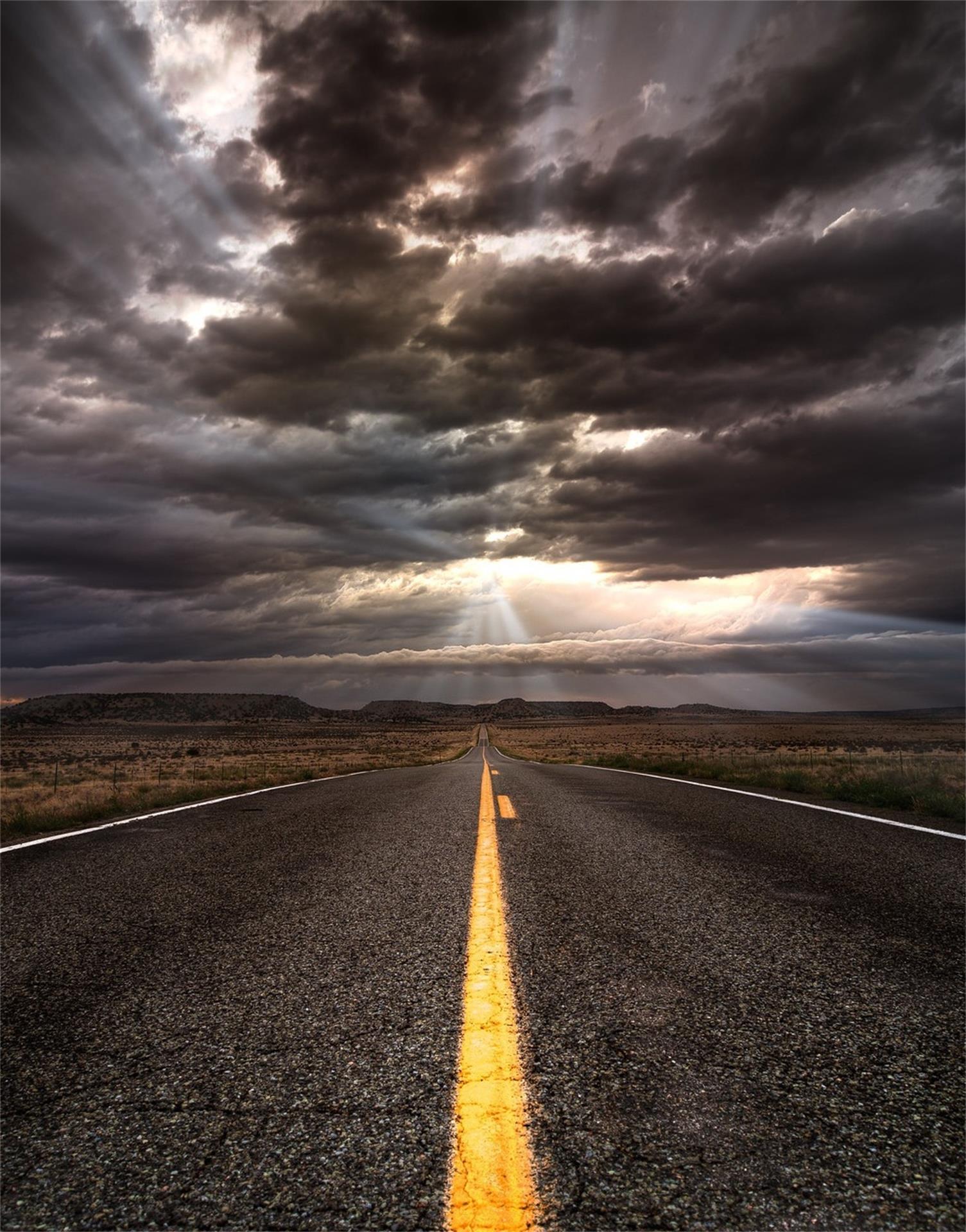 open road highway storm clouds dramatic