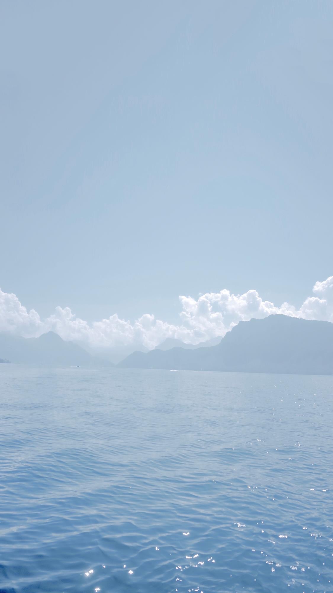 sea mountains ocean coast blue mist