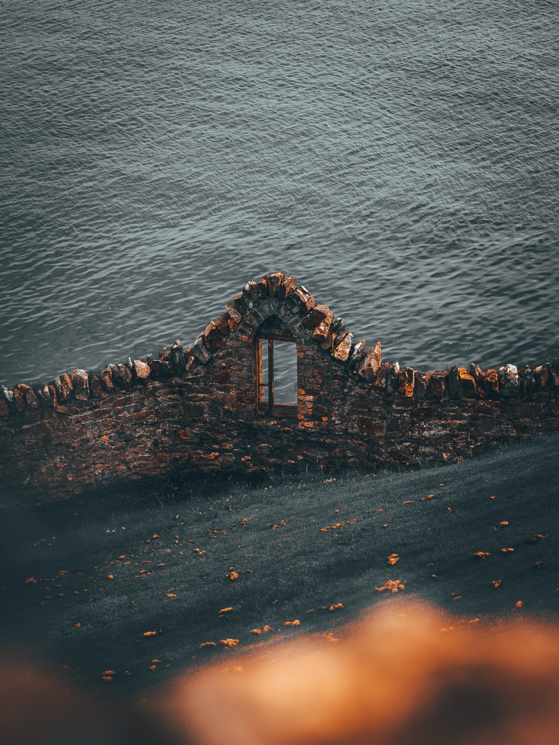 stone wall ruins window view ocean sea