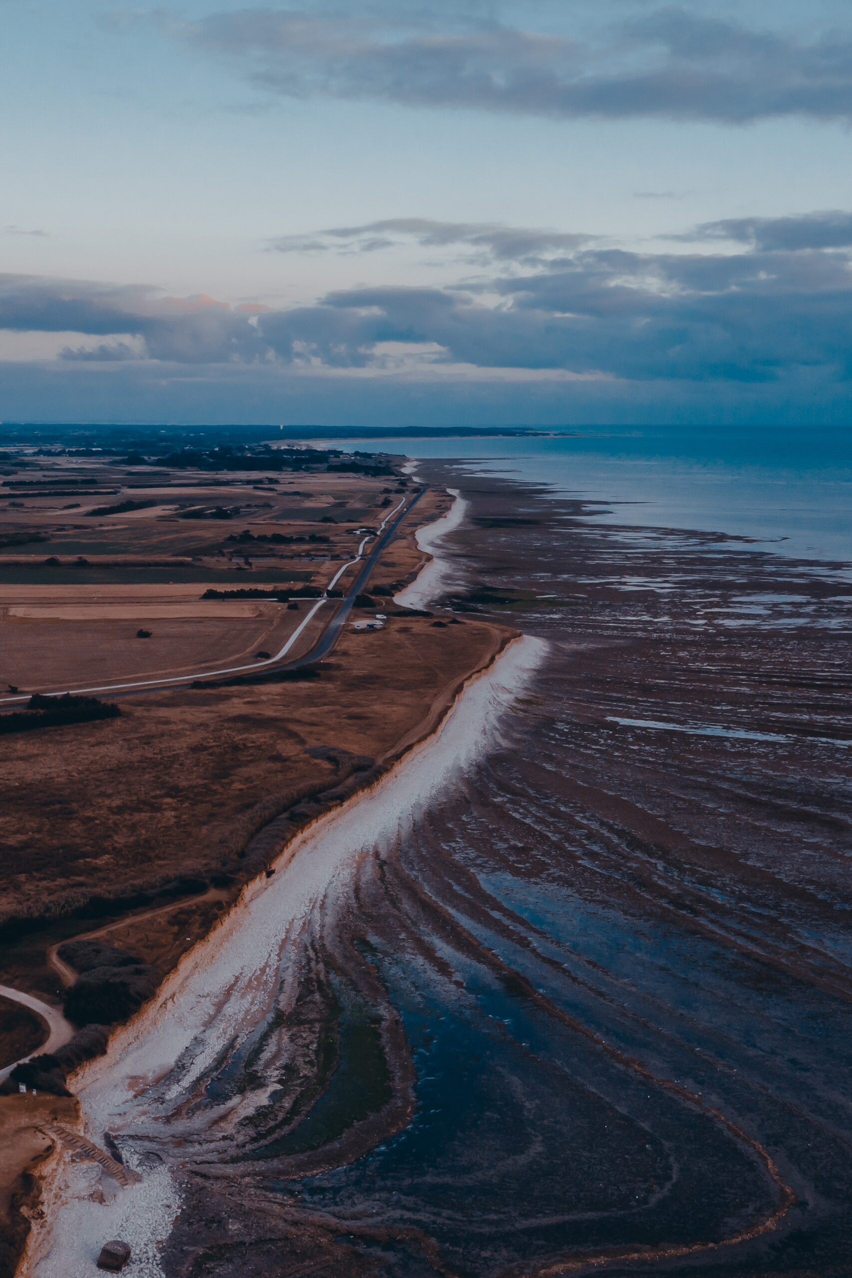 aerial coast shore ocean road fields
